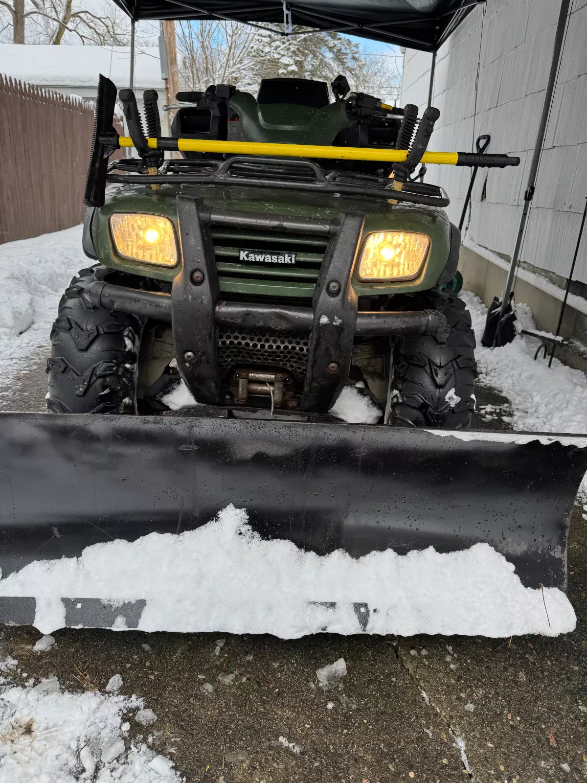 ATV with snow plow blade ready for driveway clearing, Buffalo Carpet NY