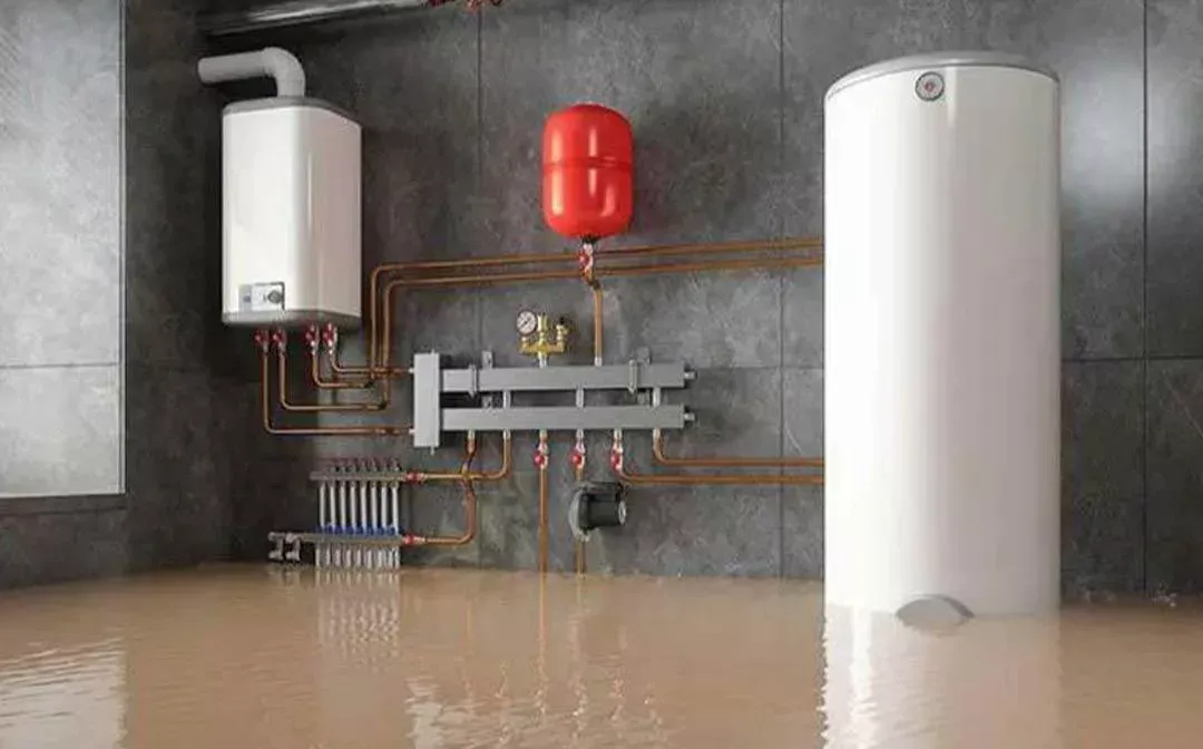 Flooded basement with standing water around a water heater, the kind of emergency Buffalo Carpet NY cleans up 24/7