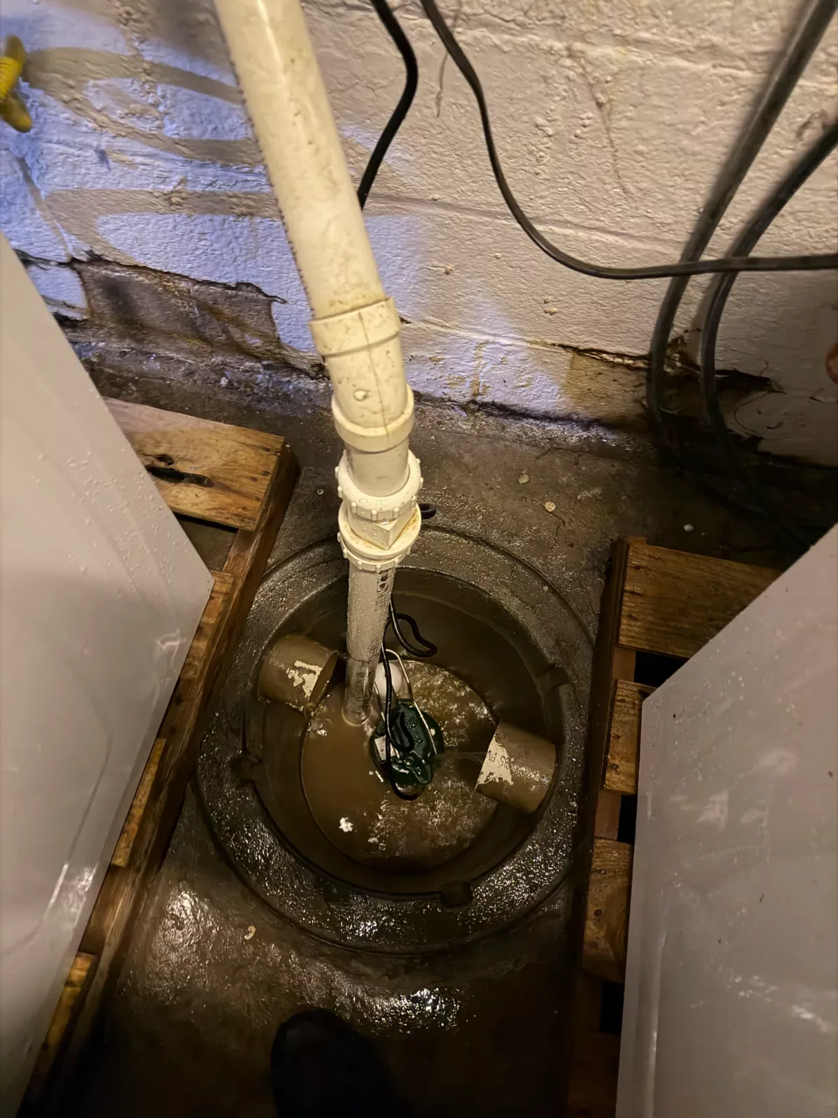 Basement sump pit during an emergency water clean up by Buffalo Carpet NY
